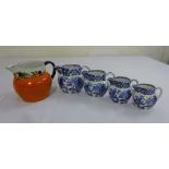 Four T.G. Green blue and white Ming jugs willow pattern circa 1912 and a T.G. Green orange Dutch