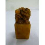 A Chinese soapstone seal with carved lion terminal