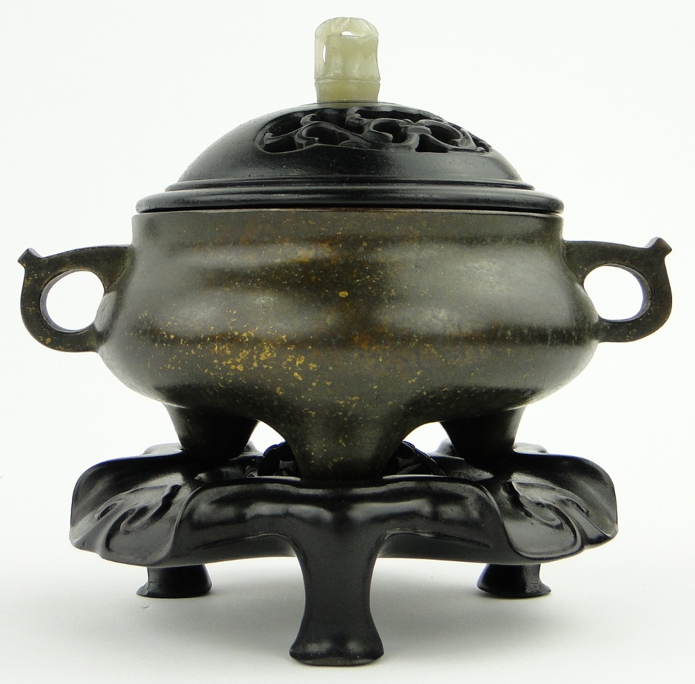 A bronze censer
on 3 feet with 6 character mark, diameter 4.5" with carved wood cover and jade knop