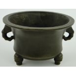 A Chinese circular bronze bowl
on three feet, with 4 character mark, diameter 4.8".