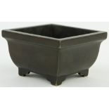 A Chinese square bronze bowl on feet
with 6 character mark, 4.5" across.