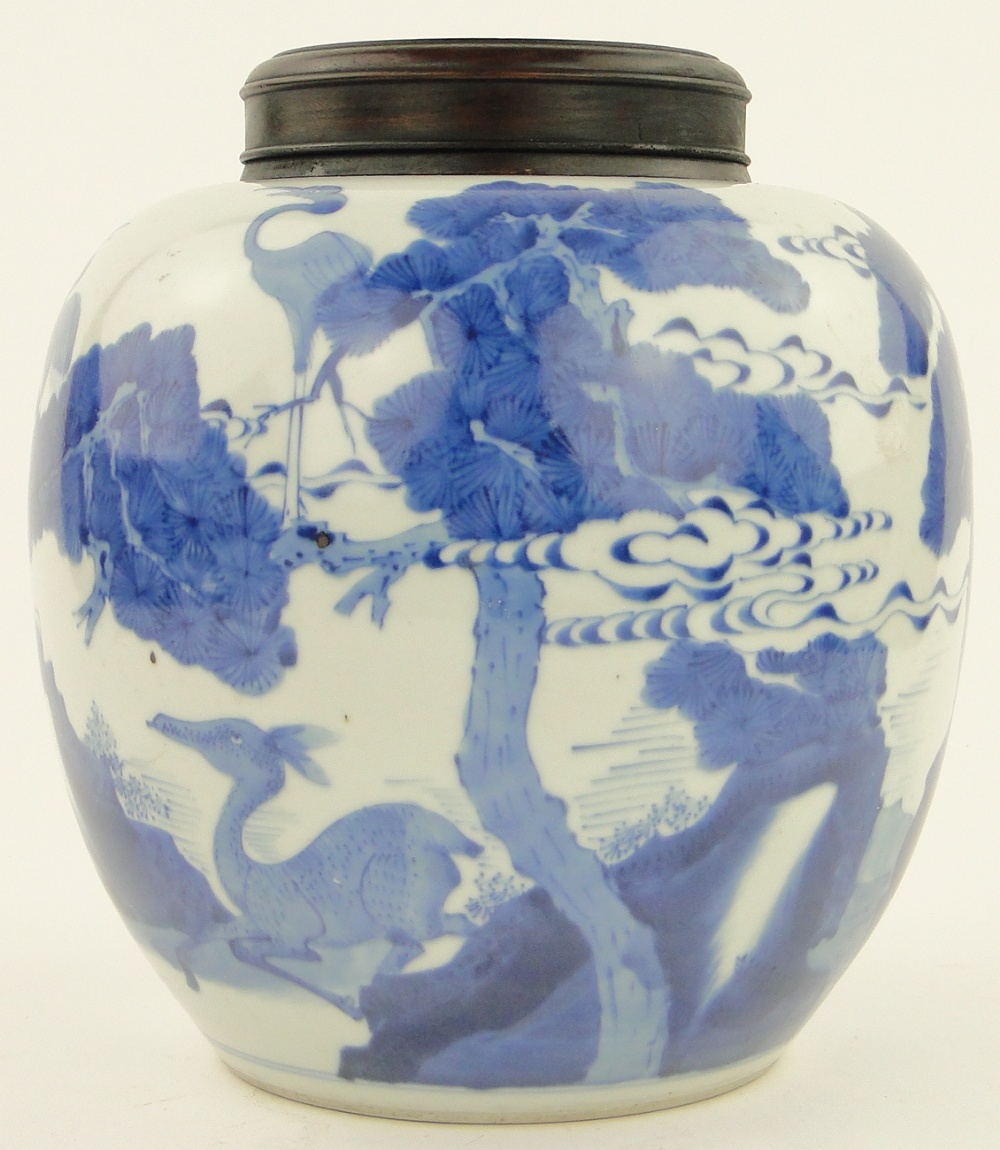 A Chinese blue and white porcelain jar
with landscape decoration, height 10.25", with a wooden