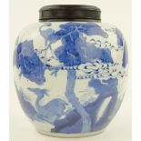 A Chinese blue and white porcelain jar
with landscape decoration, height 10.25", with a wooden