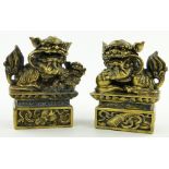 A pair of Chinese bronze dogs of fo, 
height 8".