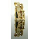 A Japanese carved ivory neksuke
depicting a sage with a bird at his side, signed, height 2".