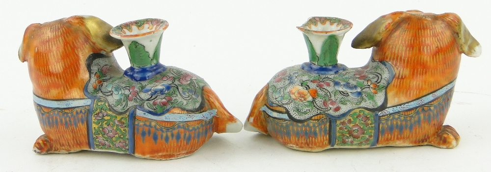 A pair of 19th century Canton enamel lion dog design taper holders,
length 4.75". - Image 2 of 7
