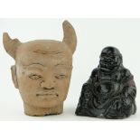 A painted Buddha, 9.5" and a terracotta Devils head.
