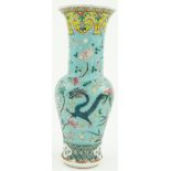 A Chinese vase
with dragon design on turquoise ground, 12".