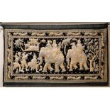 An Eastern wall hanging
decorated with elephants and figures, with inlaid stones, height 34".