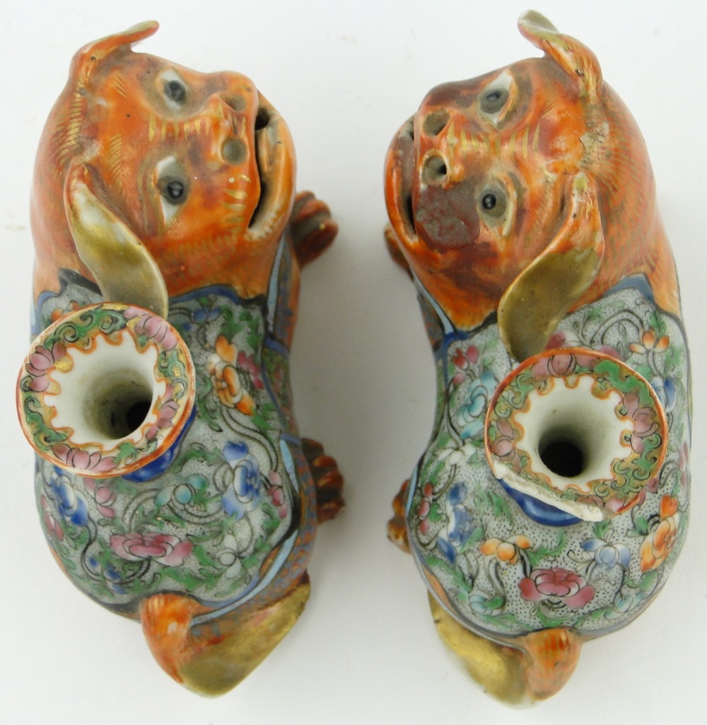 A pair of 19th century Canton enamel lion dog design taper holders,
length 4.75". - Image 3 of 7