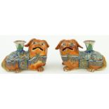 A pair of 19th century Canton enamel lion dog design taper holders,
length 4.75".