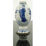 A Kang hsi caddy in blue and white
with ladies in the garden scene, and brass mounted foot, 4".