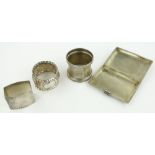 3 silver napkin rings and a silver cigarette case, (4).