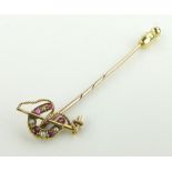 15ct gold riding crop and horseshoe design stickpin
set with rubies and pearls.