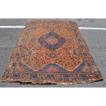 A red ground Persian design rug,
length 7'6", width 5'4".