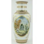 A porcelain vase
with 2 panels depicting country houses, height 22".