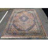 A large pink and blue ground Persian design rug,
11'3 x 8'.
