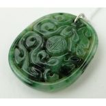 A Chinese carved and pierced jade pendant, height 35mm.