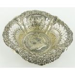 A Victorian Commemorative silver dish,
hallmarks Birmingham 1896, 11cm across.