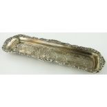 An Edwardian embossed silver pen tray,
Birmingham 1903, length 23cm.