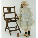 A German doll
with porcelain head by Simon & Halbig, 27", and a small doll's head.