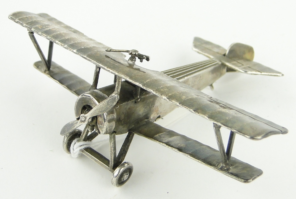 Unmarked white metal miniature bi-plane,
stamped Neuport Bebe, length 8cm.