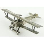 Unmarked white metal miniature bi-plane,
stamped Neuport Bebe, length 8cm.
