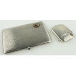 A French silver cigarette case
with sapphire set thumb piece,