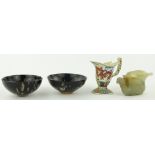 An oriental porcelain jug
with dragon design, height 4", a carved stone jug and 2 bowls, (4).