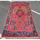 WITHDRAWN A red ground Hammadan design rug,
9'10 x 5'3.