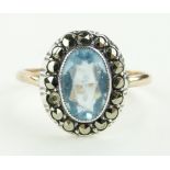 A 9ct gold topaz and marcasite set ring, setting height 15mm, size R.