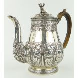 A George III silver coffee pot,
surmounted by a figure of a Chinaman, with acanthus decorated body,