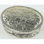 A 19th century oval silver box,
the lid depicting an 18th century battle scene, London 1885,