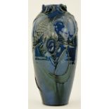 A Brannam Barum pottery vase
with moulded and pierced design of a fish amongst weeds, signed F B,