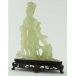 Oriental carved jade figure with a dog,
on carved plinth, height 8.25" overall.