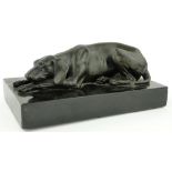 A bronze figure of a resting hound
on marble plinth, circa 1900, length 9.25" overall.