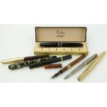 Various fountain pens
including two early Watermans, one with retractable nib and gold banded,