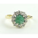 18ct emerald and diamond cluster ring,
setting height 10mm, size N.