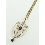 Edwardian 9ct gold open work pendant,
set with amethysts and pearls on 9ct chain.