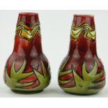 A pair of Minton Secessionist Art Nouveau vases
with tube-lined decoration, no. 42, height 5.25".