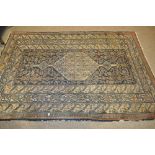 A blue ground Persian design rug with medallion decoration,
6'2" x 4'2".