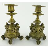 A pair of Oriental brass candlesticks, 
height 7".