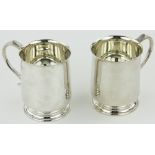 A pair of modern silver pint mugs by Cooper Bros.
23.5oz total.