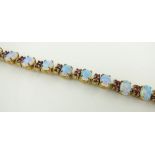 A 9ct gold opal and red stone set bracelet, a/f.