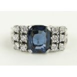 A 14ct white gold sapphire and diamond dress ring,
diamond content approx. 0.35cts, size N.