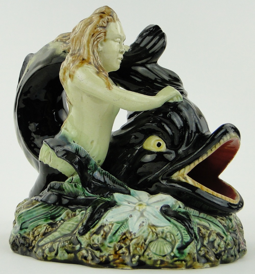 Antique Majolica study of a mermaid with a dolphin, 
height 8.5".