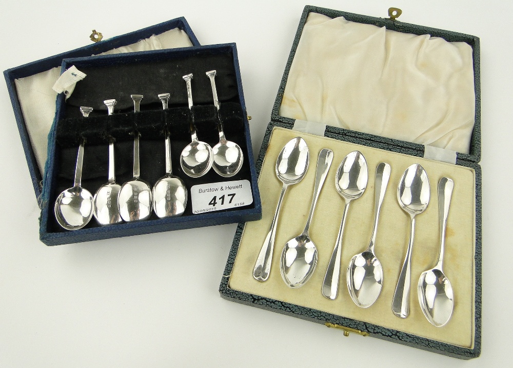 2 sets of silver coffee spoons.