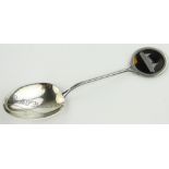 An R M S Lusitania Commemorative silver spoon
with inset tortoise shell panel depicting the ship,