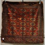 A red ground Balochi rug with gull decoration,
3'7" x 3'7".