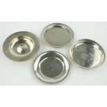 4 small circular silver coasters.